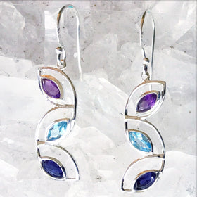 Sterling Mixed Gem Earrings of Cascading Leaves feature faceted Marquis-shaped Amethyst, Blue Topaz and Iolite gemstones. The precious earrings are 1.5” long. New Earth Gifts
