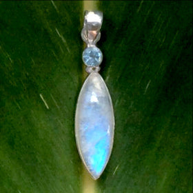 Don't miss this gorgeous Rainbow Moonstone Marquis Pendant with Blue Topaz Accent set in sterling silver! The slender pendant is a striking 2" long, .5" wide. New Earth Gifts