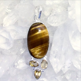 The combination in this Tiger Eye and Citrine Sterling Silver Pendant is stunning! Faceted Citrine gemstones adorn the bottom of an oval Tiger Eye. 2” long. - New Earth Gifts