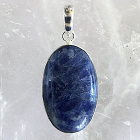 Sterling Sodalite Classic Oval Pendant, 1.75" long, has deep navy color and white lines traditionally seen in Sodalite. Highly polished 30mm White Spot Sodalite. New Earth Gifts