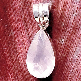 Lovely Rose Quartz Faceted Teardrop Sterling Pendant Set in Sterling Silver; approximately 1”x 3/4”. The natural beauty of a Rose Quartz Pendant (the symbol of universal love) invokes a loving relationship we seek or already have. Rose Quartz is the "relationship stone" - signifying unconditional love, romantic love, friendship, family, caring, kindness. It links self-love with the earth and the universe, relieving stress and promoting trust and calm. 