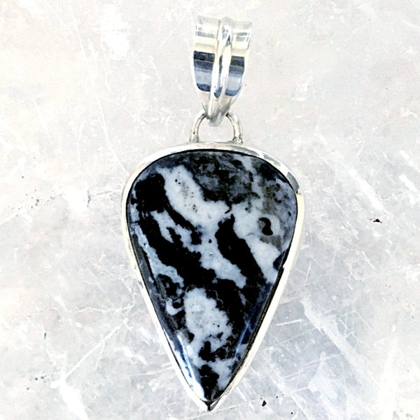 Zebra Jasper Pendant  - Yin Yang Stone for Balance. Zebra Jasper in a sterling silver reverse tear drop gives the feeling of power, much like an arrowhead. 2" x 1" - New Earth Gifts and Beads